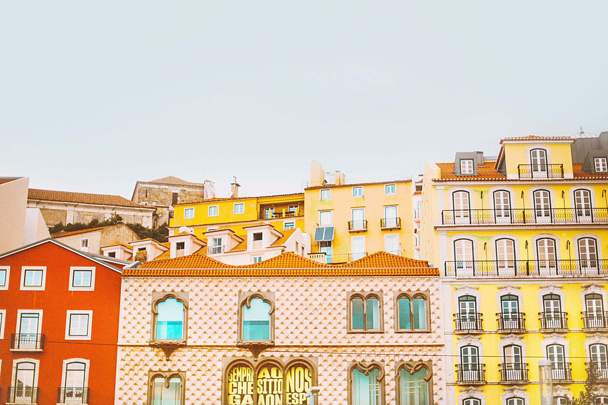 Colourful Lisbon building facades representing Plexus Freight's Portugal freight forwarding services