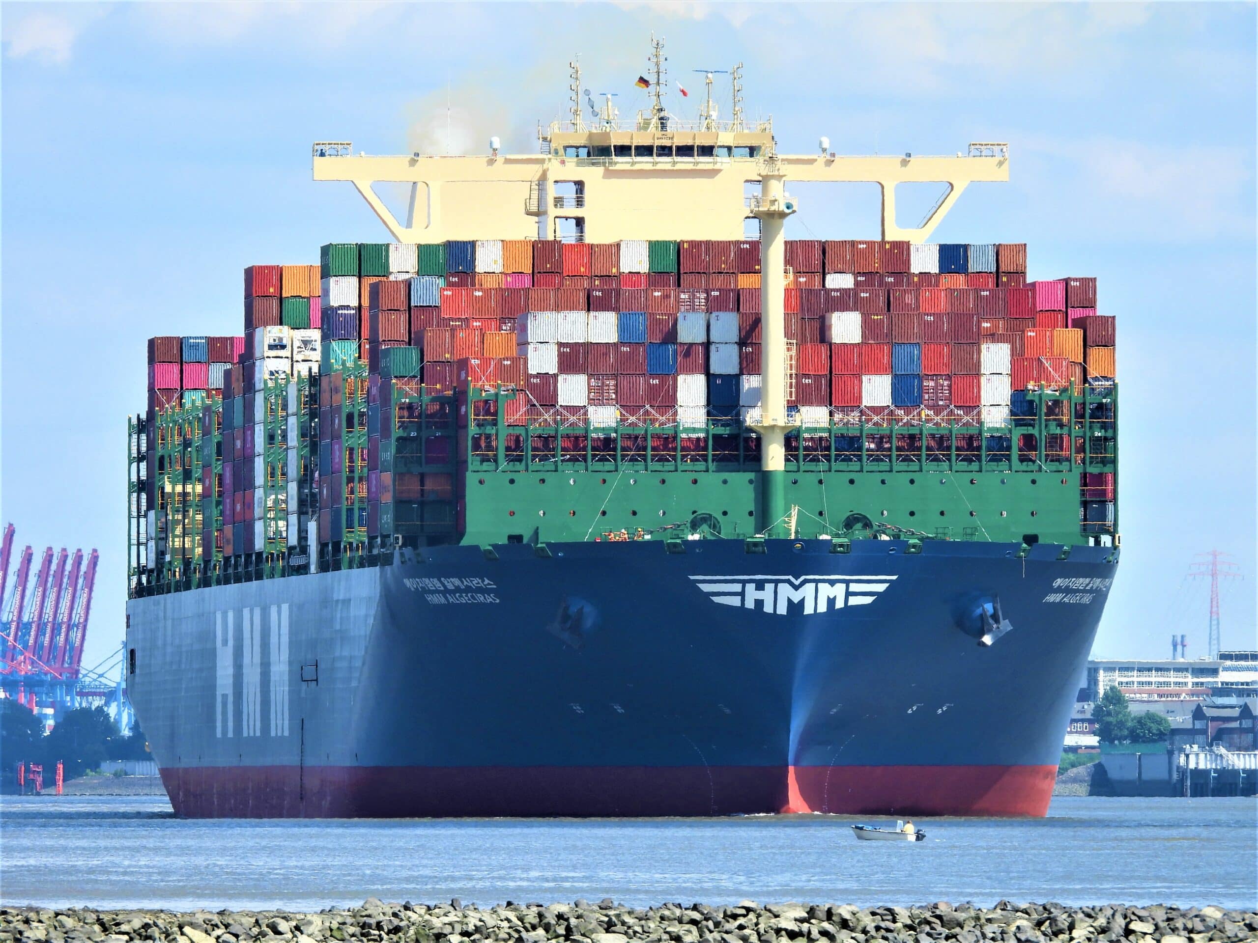 Large container vessel loaded with multicolour shipping containers representing Plexus Freight's FCL sea freight services